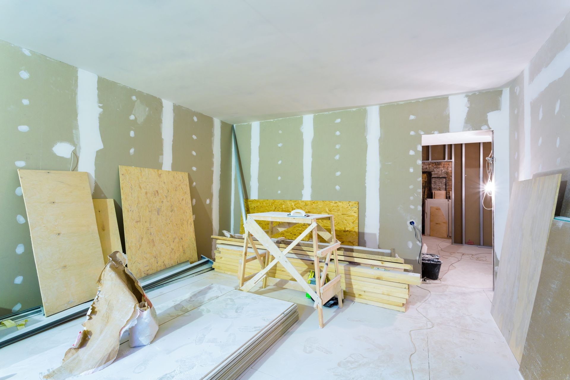 Materials for construction - putty packs, sheets of plasterboard or drywall- in apartment is under construction, remodeling, renovation, extension, restoration and reconstruction. 